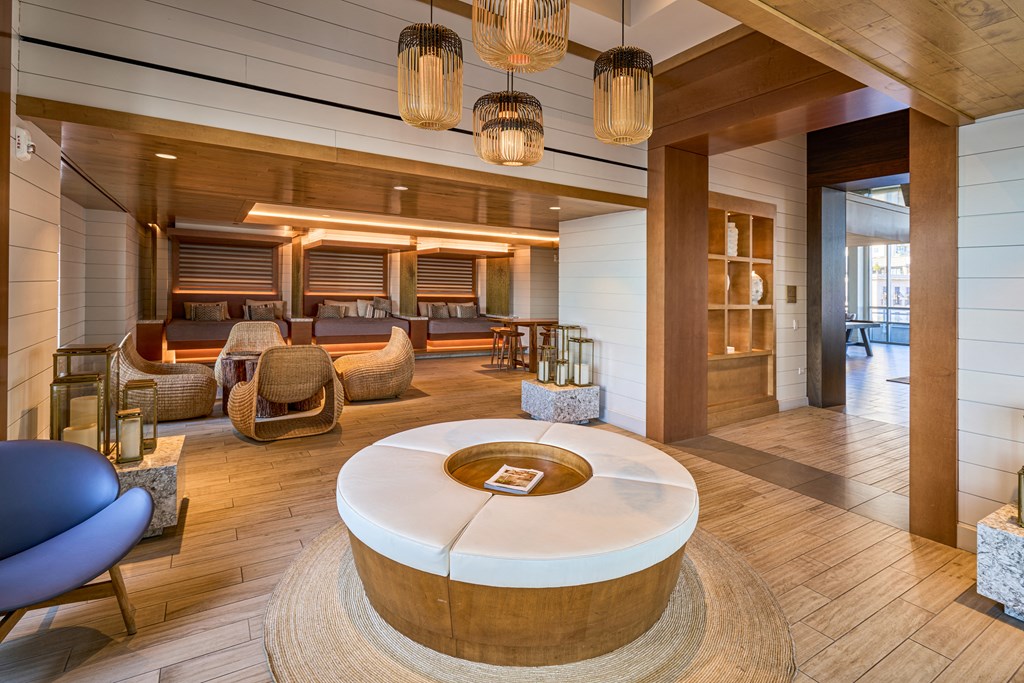 a living room with furniture and a round table