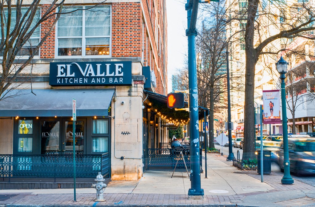 a restaurant on the corner of a city street