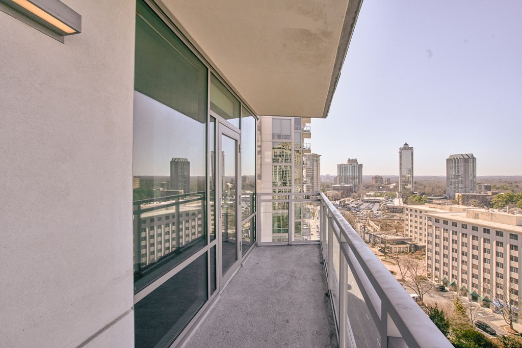 views of the city from the balcony of a condo