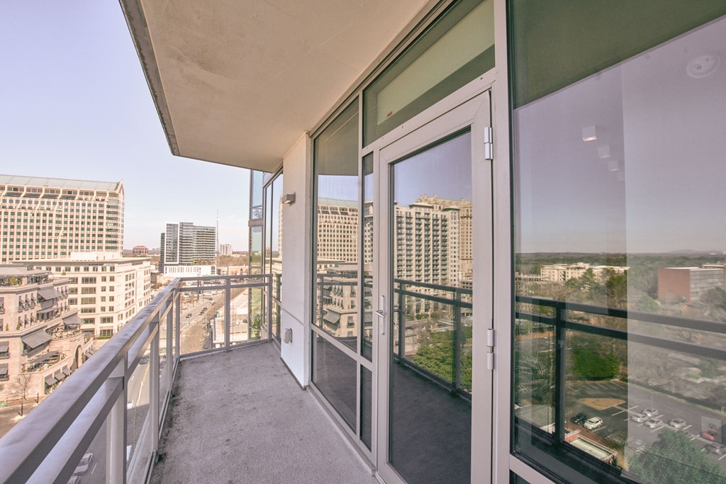 the view of the city from the balcony of a condo