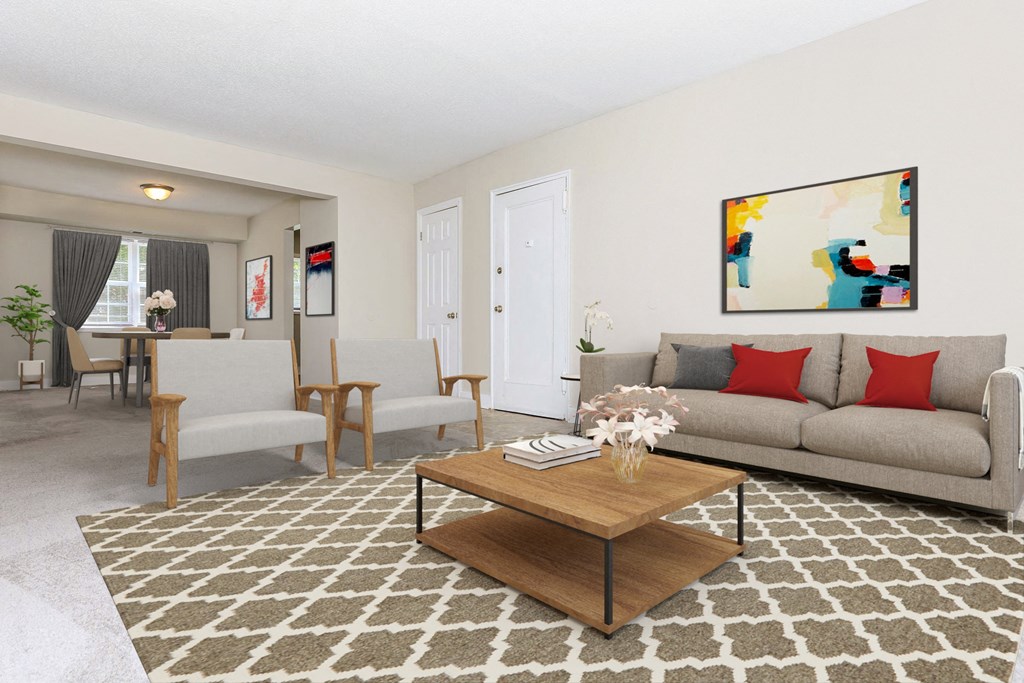 a living room with a couch and a coffee table at Parkland Village, Forestville, MD 20747