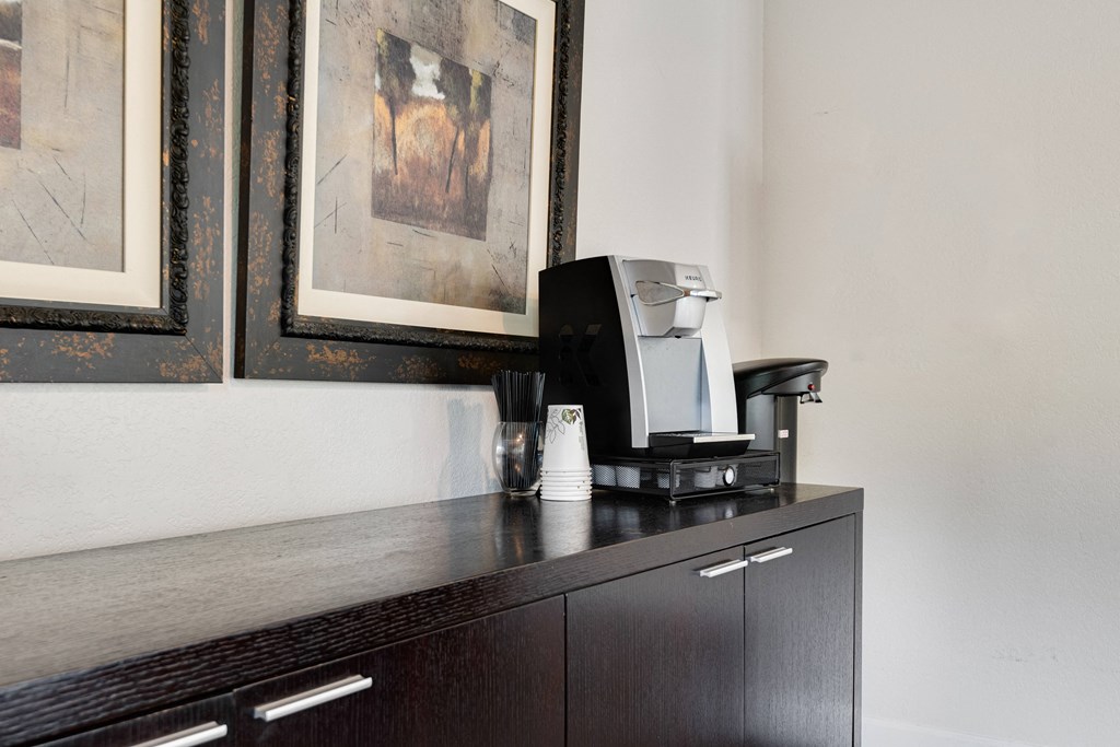 a coffee maker sitting on top of a cabinet in a hotel room at Eagles Landing Apartments, Everett, 98204