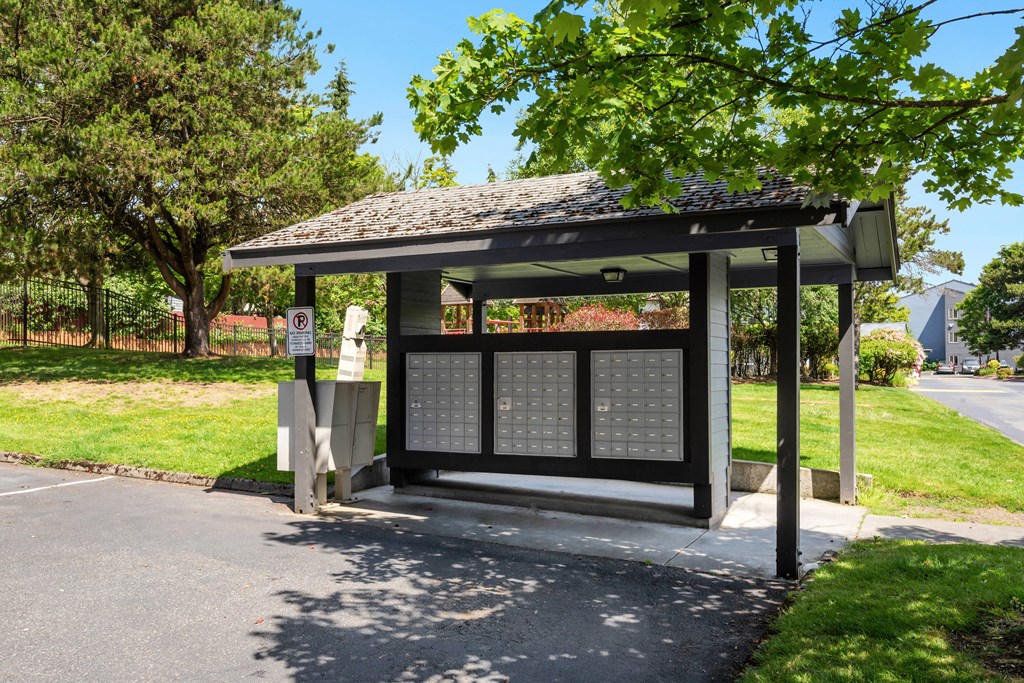 a bus stop with a shelter on the side of a road at Eagles Landing Apartments, Everett, WA