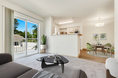 a living room with a couch and a coffee table at Sage Apartments, Everett, WA