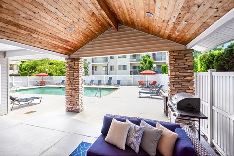 pool and patio with furniture and a grill  at Sage Apartments, Everett, WA, 98204