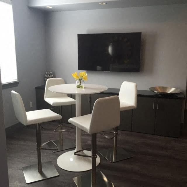 a dining room with a table and chairs