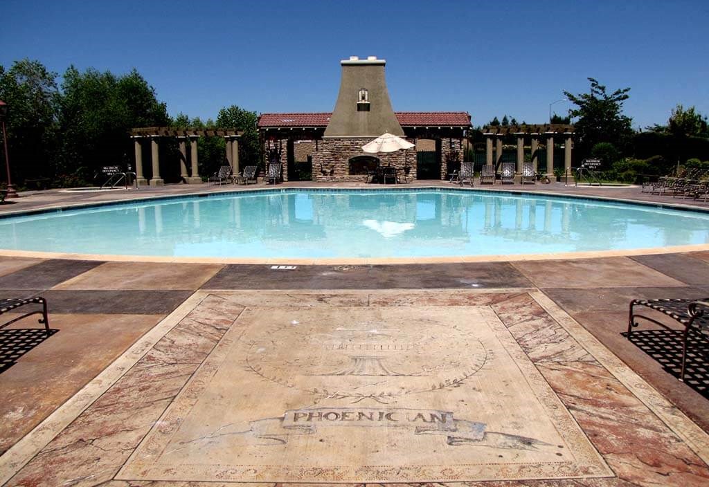 a large swimming pool in front of a house
