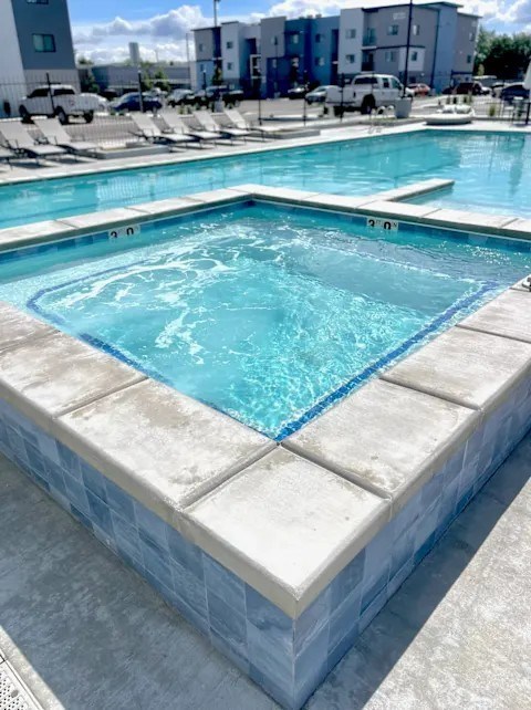 A small pool with a blue tiled edge.