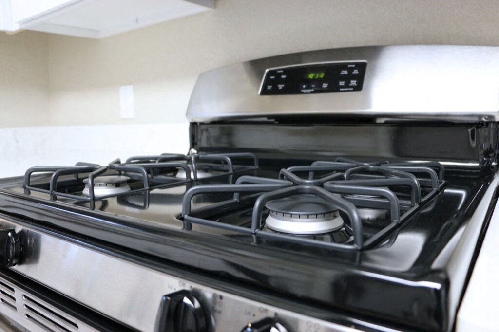 Renovated Kitchen with stainless steel appliances and quartz countertops at Elme Cumberland Apartments, Smyrna, Georgia