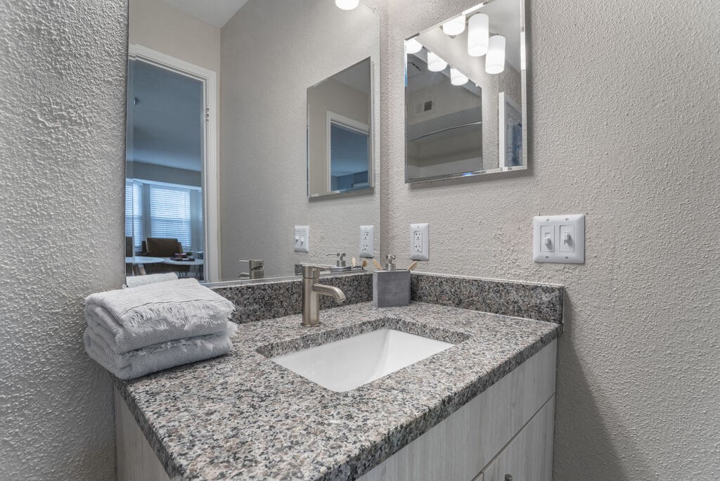 Bathroom with updated vanity and shower at Elme Herndon, Herndon, 20171