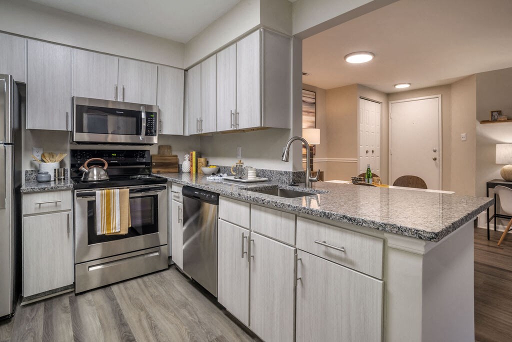 Renovated Kitchen with stainless steel appliances and granite countertops at Elme Manassas, Virginia