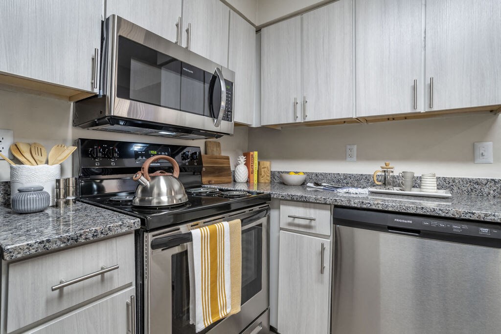 Renovated Kitchen with stainless steel appliances and granite countertops at Elme Manassas, Virginia