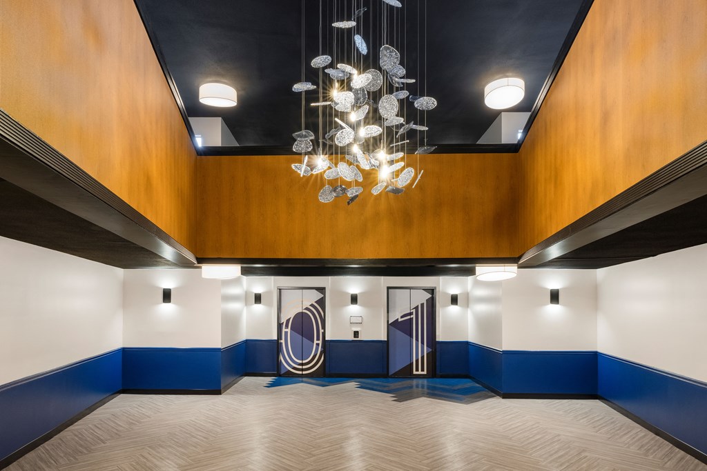 Big lobby with chandelier and two elevators at Elme Alexandria, Alexandria, 22304