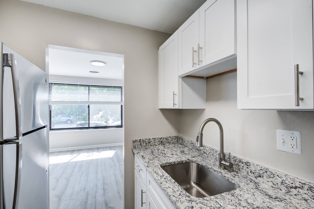 Renovated Kitchen with stainless steel appliances and granite countertops at Park Adams Arlington, VA
