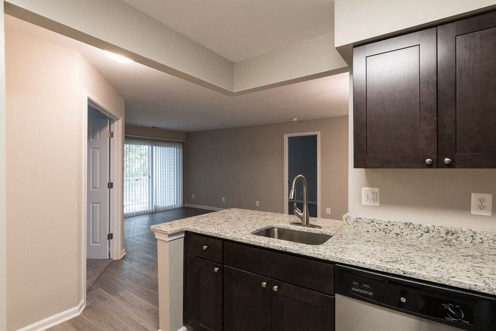 Kitchen with stainless steel appliances and granite countertops at Elme Manassas, Virginia
