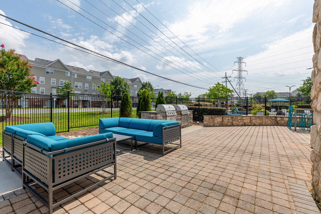 the preserve at ballantyne commons furnished patio with blue couches