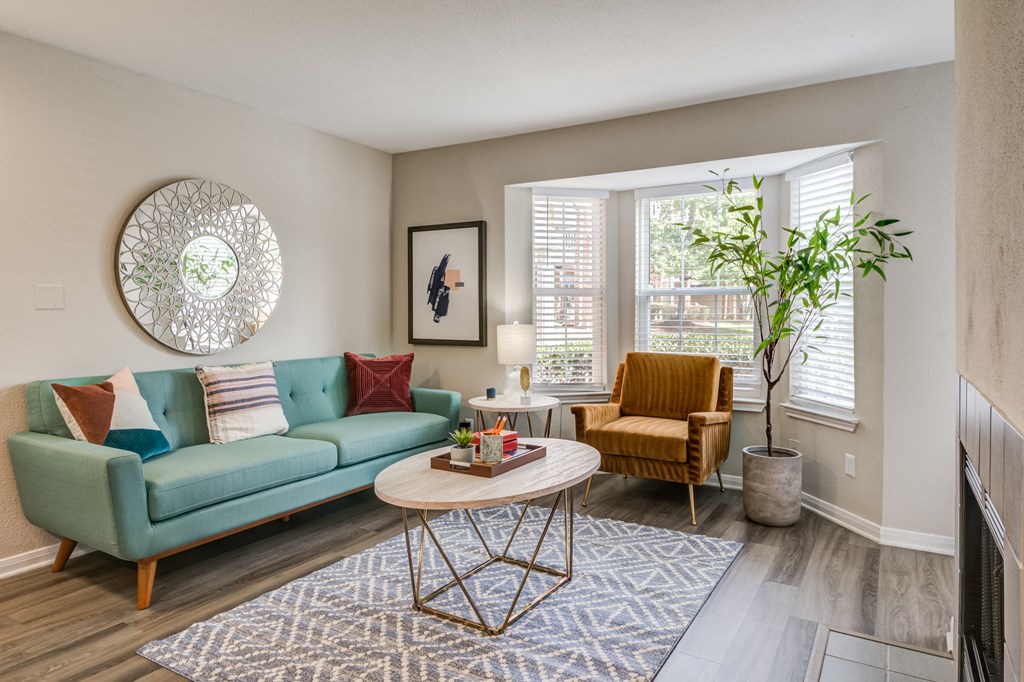 a living room with a blue couch at Elme Herndon, Herndon, Virginia and a coffee table