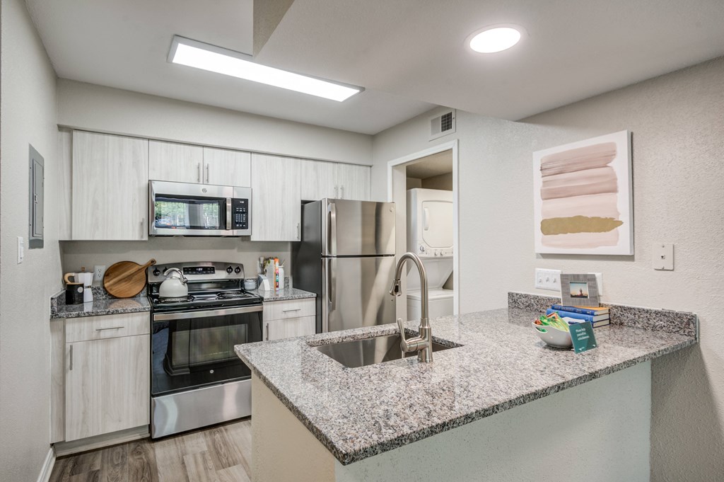 Renovated Kitchen with stainless steel appliances and granite countertops