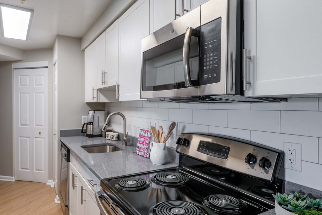 kitchen with stainless steel appliances and white cabinets  at Cascade at Landmark, Alexandria, 22304