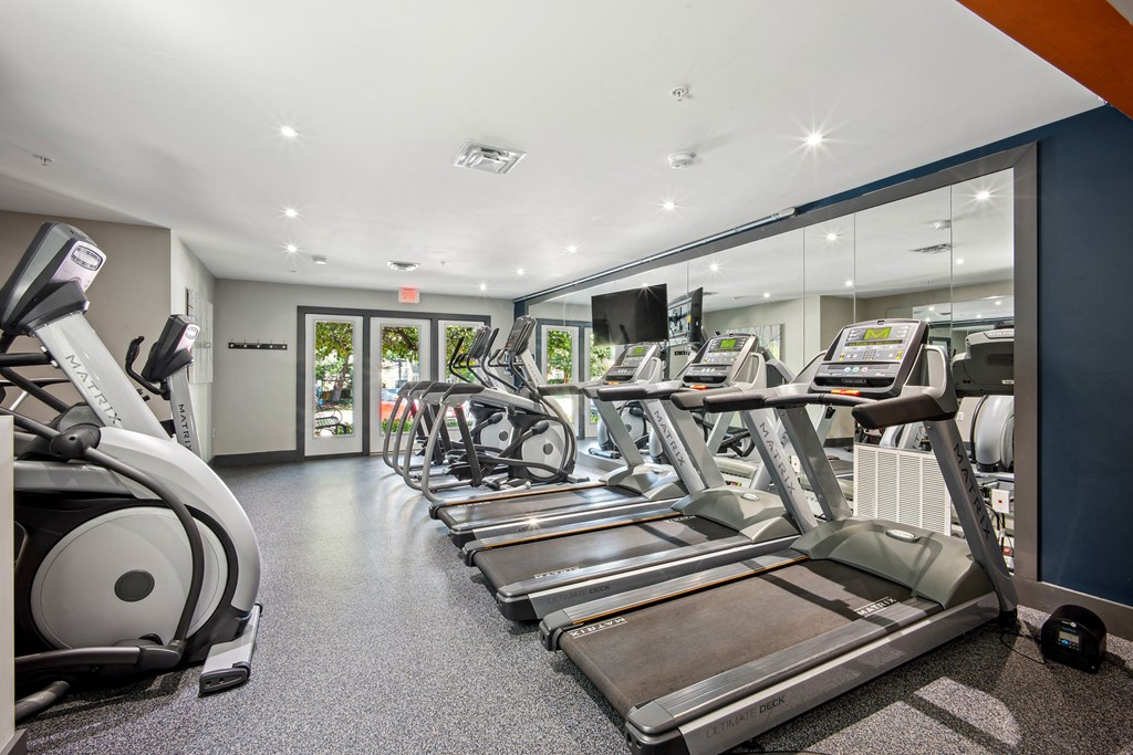 A gym with treadmills and elliptical machines at Elme Bethesda, Bethesda, 20814