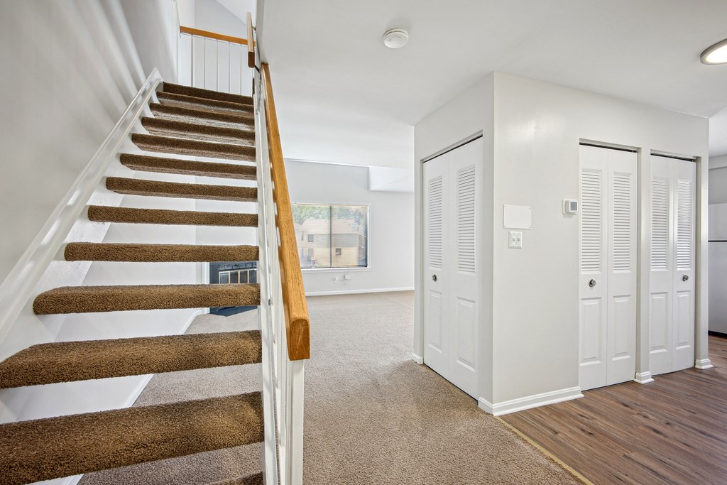 A staircase with a wooden handrail at Elme Bethesda, Bethesda, 20814
