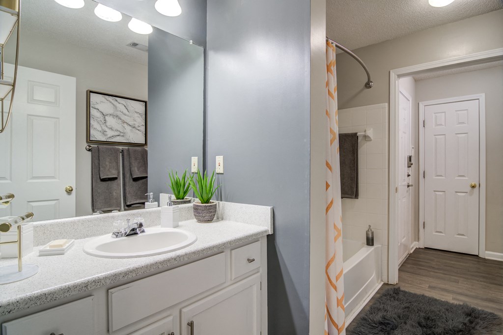 a bathroom with a sink and a shower and a mirror at Elme Conyers, Conyers, GA
