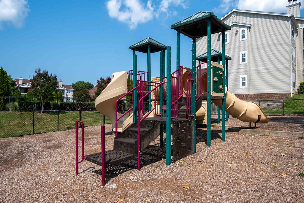 our playground is equipped with a variety of equipment including a slide
