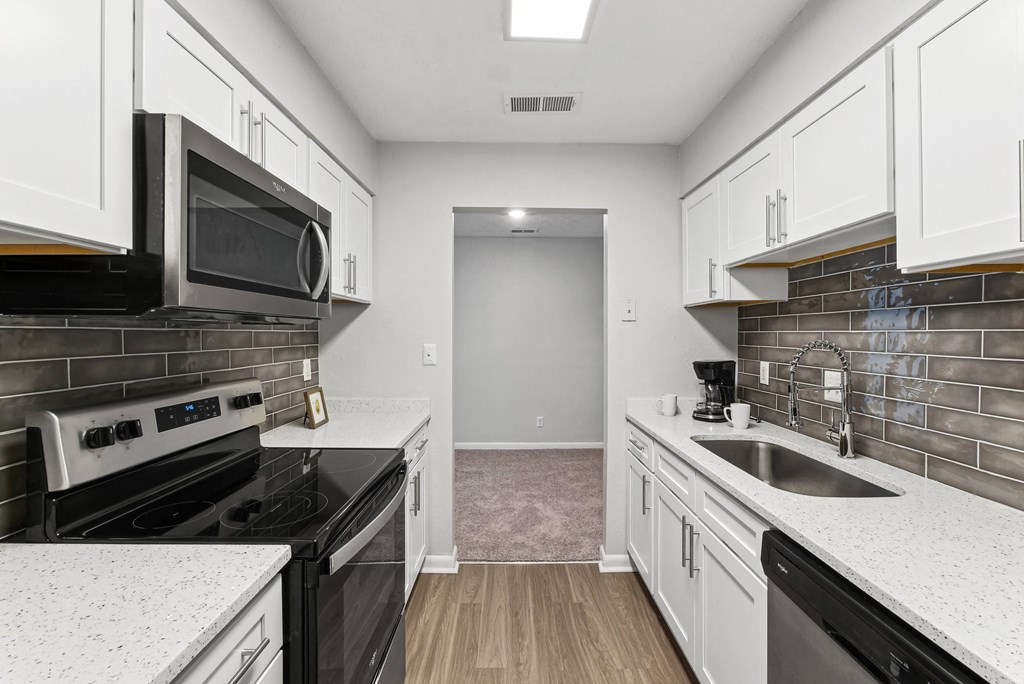 A kitchen with black appliances at Elme Sandy Springs Apartments, Atlanta, GA, 30350