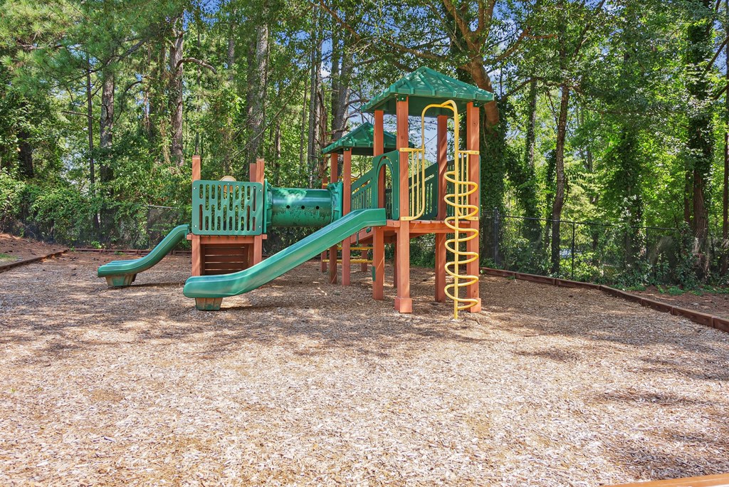 A playground with a green slide at Elme Sandy Springs Apartments, Atlanta, GA, 30350