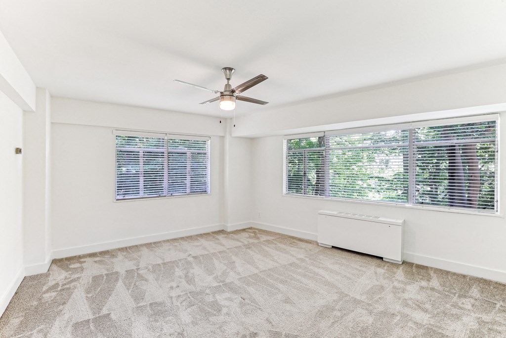 A room with a ceiling fan and a window with blinds at 3801 Connecticut Avenue, Washington, 20008