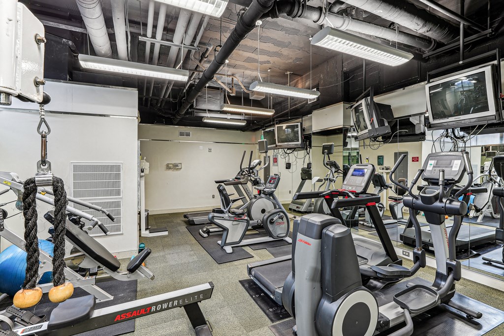 A gym with a variety of equipment including treadmills and exercise bikes at 3801 Connecticut Avenue, Washington, 20008