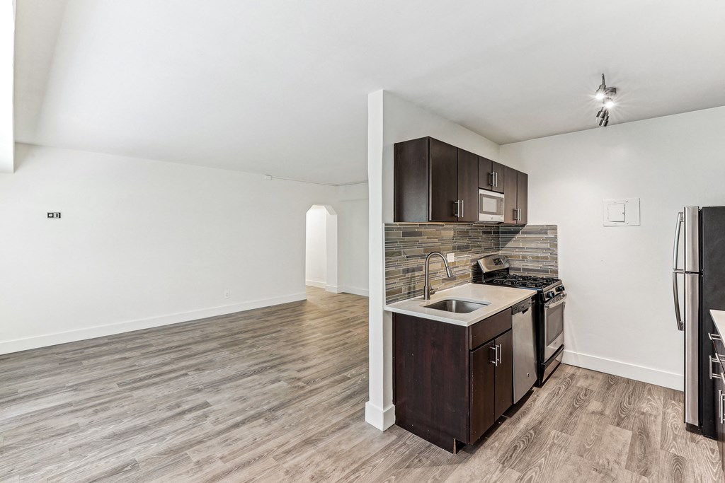 A kitchen with a sink, stove, and refrigerator at 3801 Connecticut Avenue, Washington, 20008