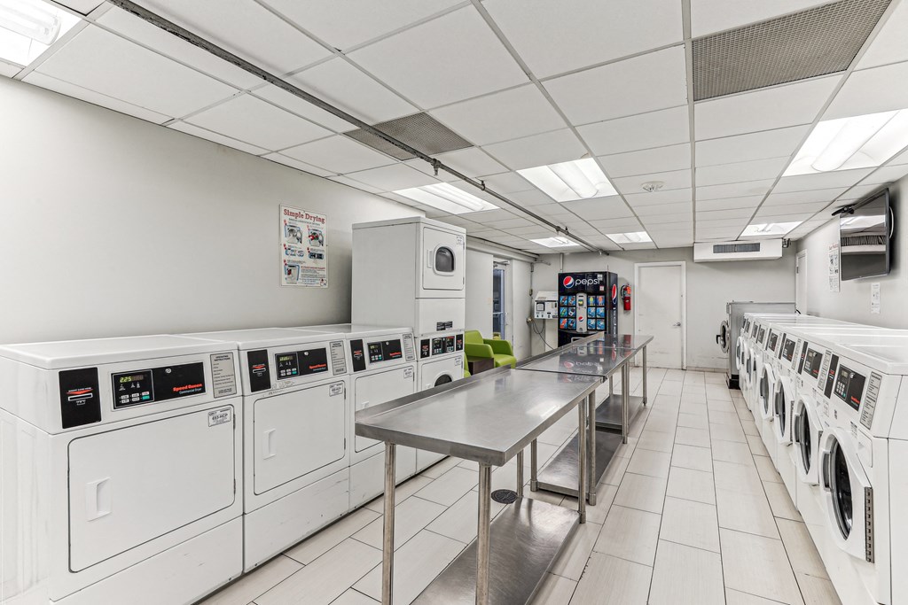 A laundromat with a row of washers and dryers at 3801 Connecticut Avenue, Washington, 20008