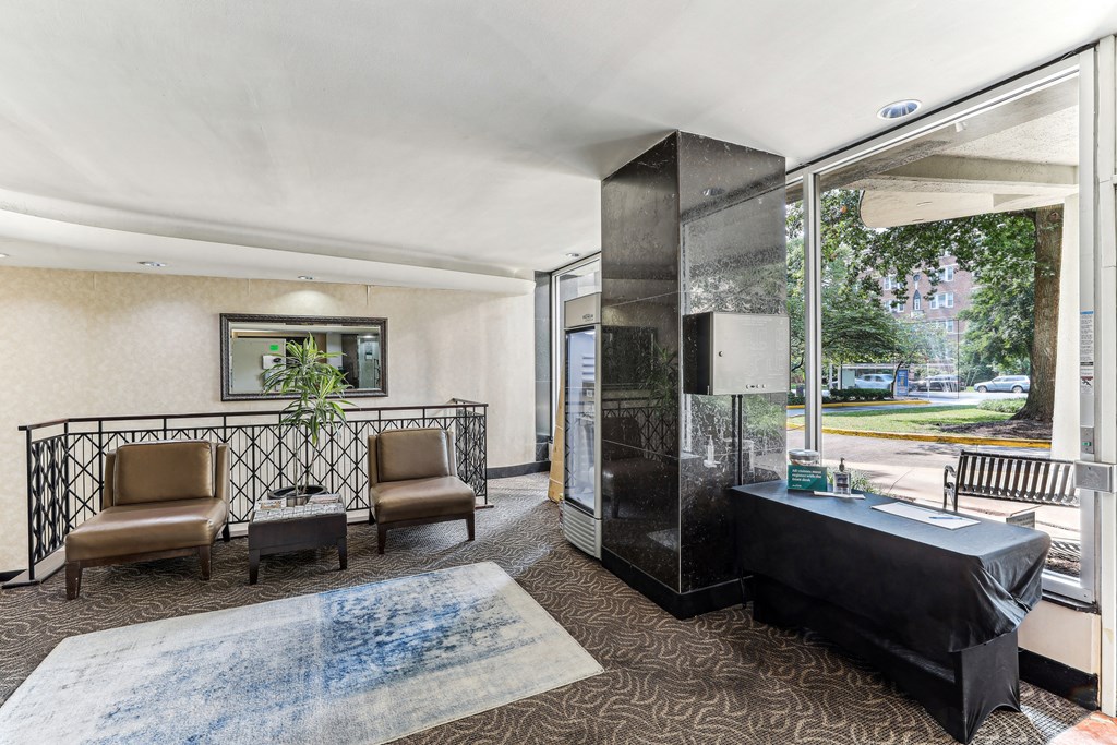 A waiting room with two chairs and a table at 3801 Connecticut Avenue, Washington, 20008