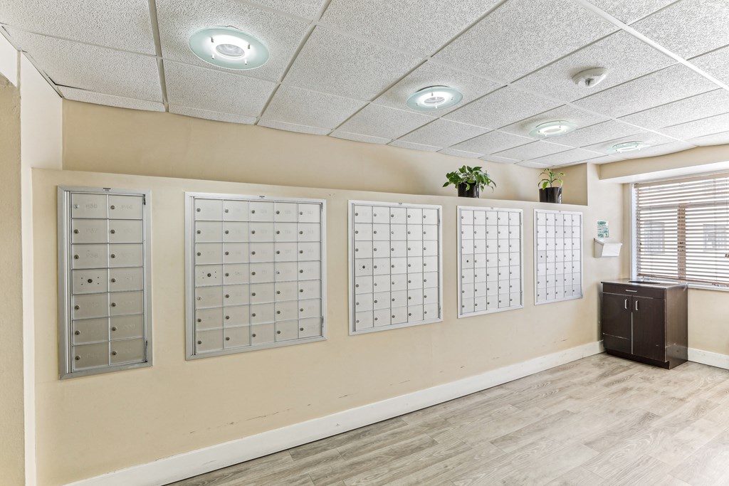 A wall with a calendar and a plant on top of it at 3801 Connecticut Avenue, Washington, 20008