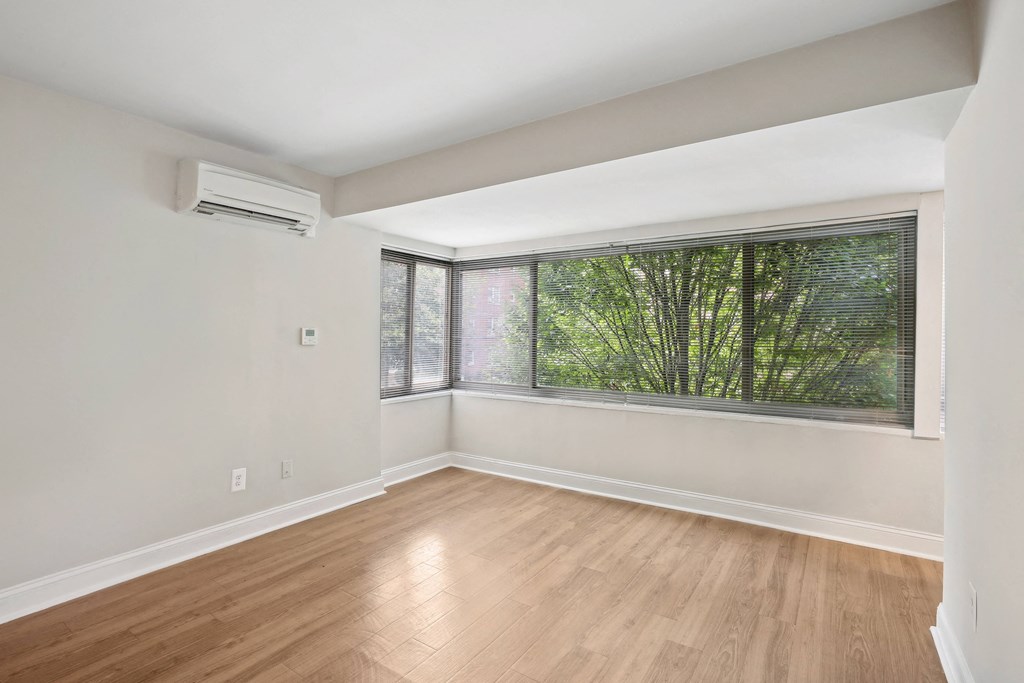 A room with a window and wooden flooring at The Kenmore, Washington, 20015