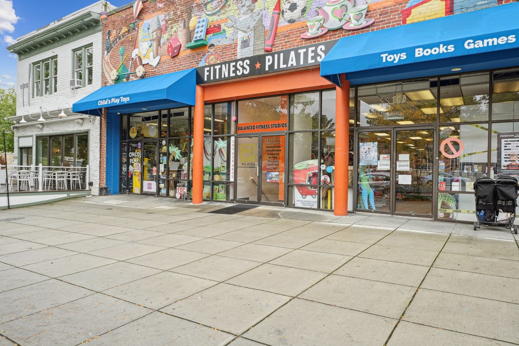 A storefront with a sign that reads The Kenmore, Washington, 20015