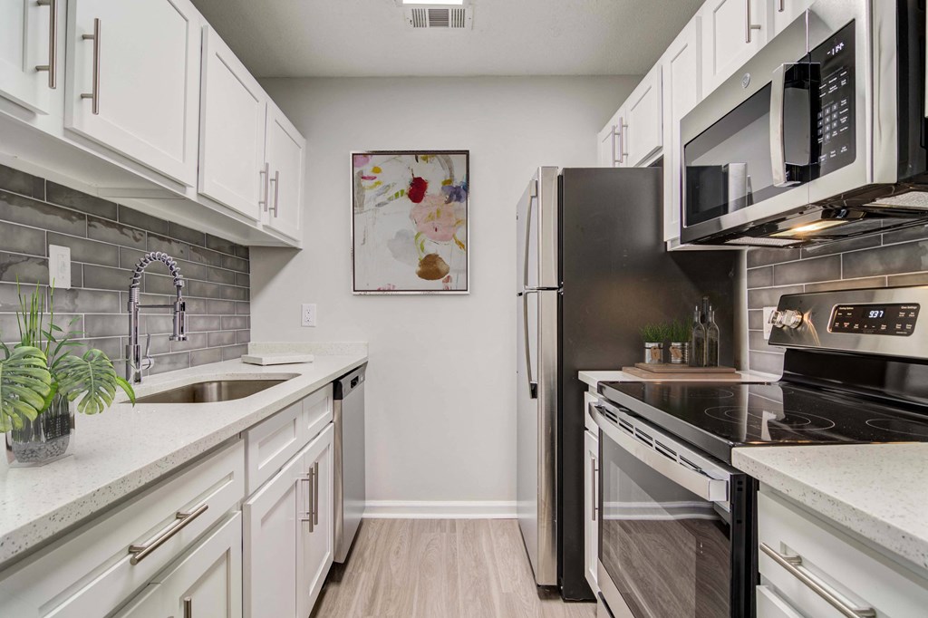 Renovated Kitchen with stainless steel appliances and granite countertops at Elme Marietta Apartments, Marietta, GA