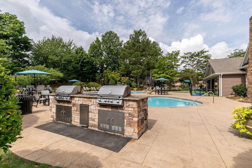 Grilling station and pool at Elme Marietta Apartments, Marietta, GA