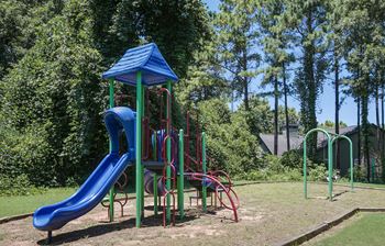 a playground with a slide and monkey bars at Elme Druid Hills, Atlanta, GA