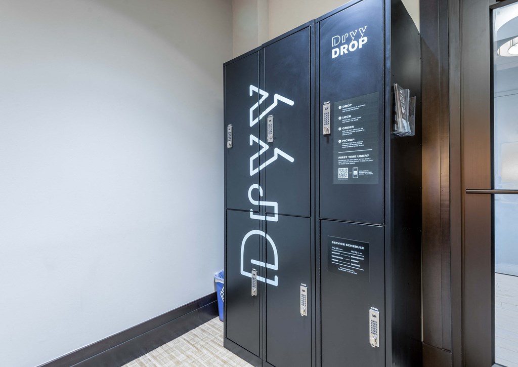 a row of lockers in a room with a white wall
