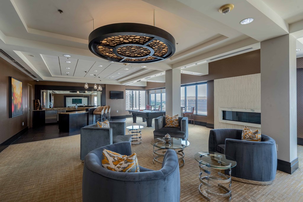 a large lobby with couches and chairs and a bar