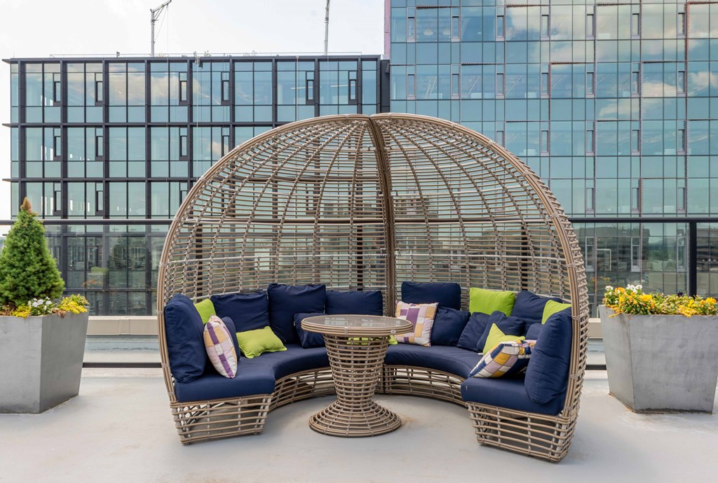 a seating area with couches and a round table