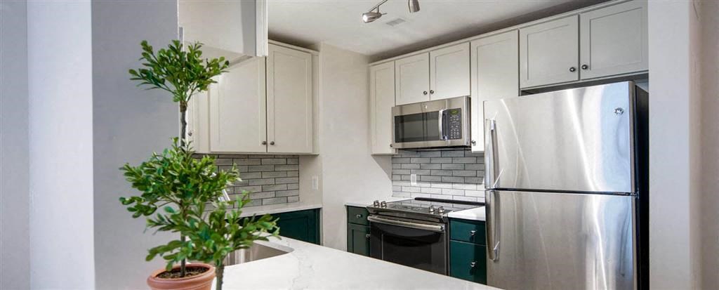 Kitchen appliances and cabinets at Bennett Park Apartments, Arlington, Virginia