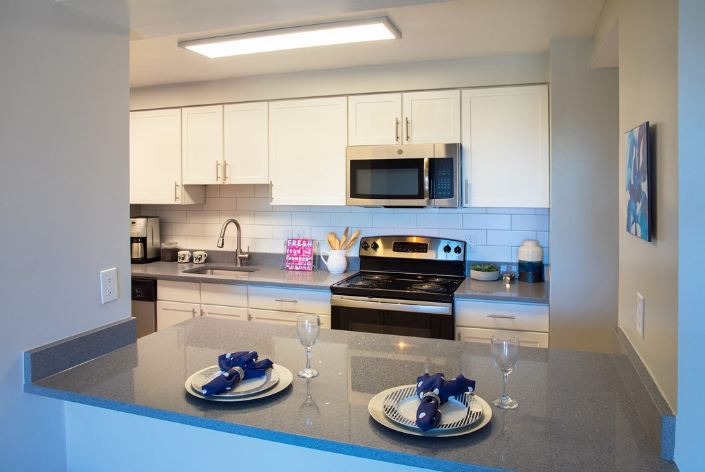 kitchen with stainless steel appliances and white cabinets  at Cascade at Landmark, Alexandria, 22304