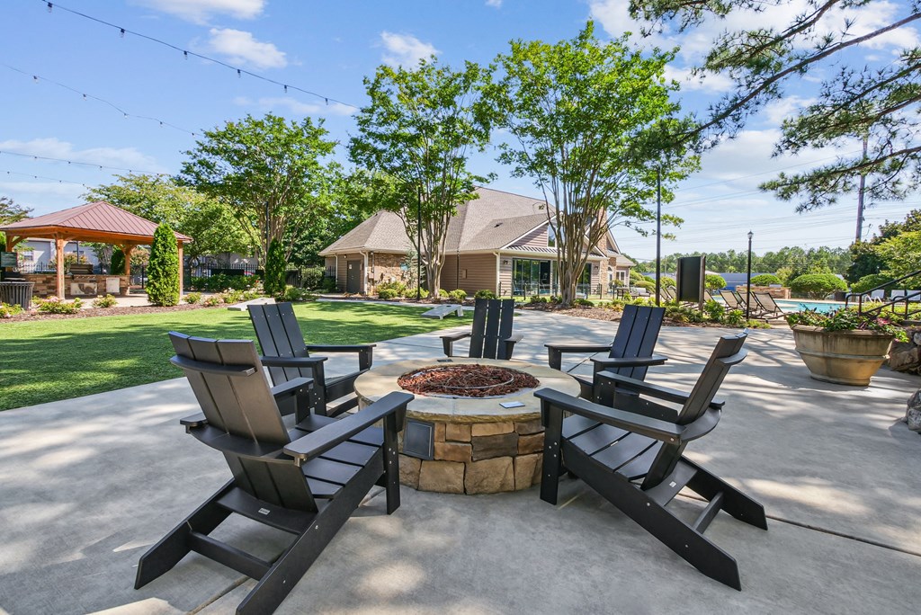A patio with a fire pit and chairs at Elme Marietta Apartments, Marietta, GA