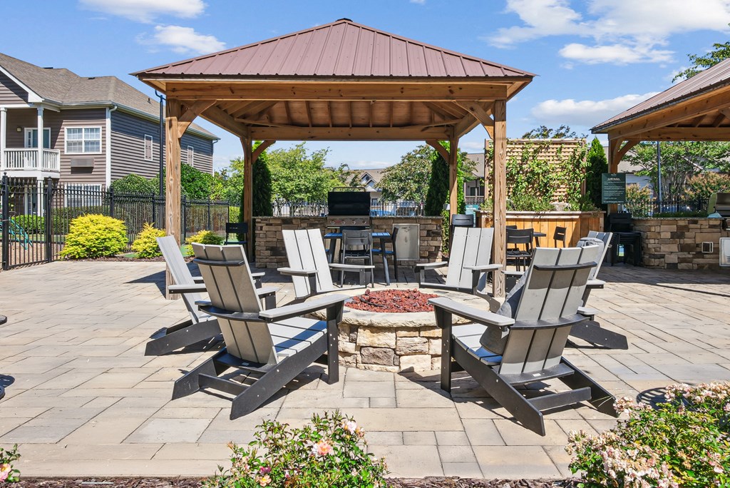 A patio with a fire pit and chairs at Elme Marietta Apartments, Marietta, GA