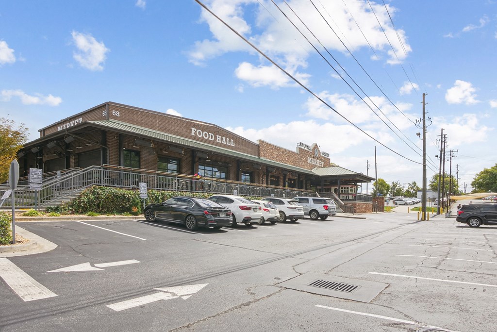 A building with cars parked in front.
