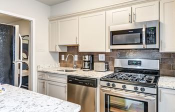 Newly Renovated Apartments Feature Open Kitchens with Updated Appliances, Countertops and Backsplashes