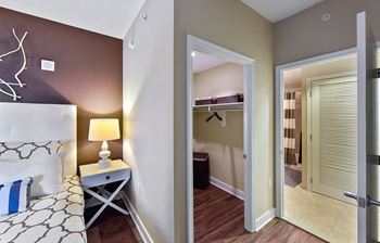 a bedroom with a bed and a mirror at Yale West, Washington